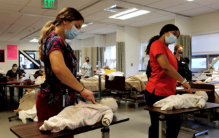 Students practice on dummies