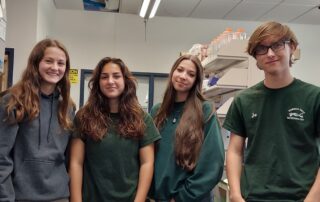 students standing election smiling